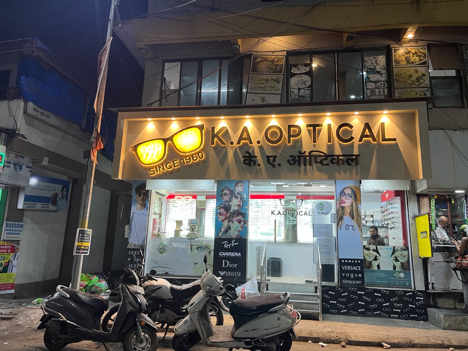 Wide exterior storefront signboard of K.A. Optical in Vasai